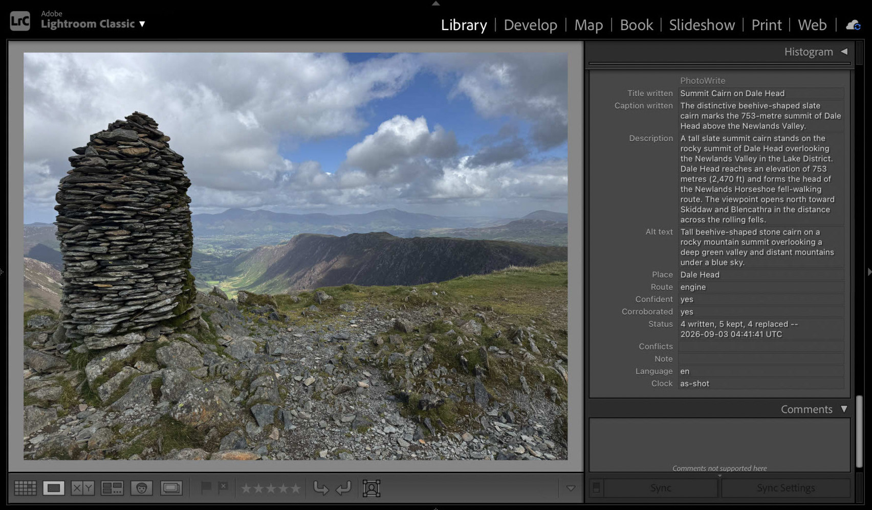 Lightroom Classic showing a photograph of a tall slate summit cairn on Dale Head,
                  with the PhotoWrite panel beside it filled in: a title, a caption, an extended
                  description naming the 753-metre summit and the Newlands Horseshoe, alt text, and
                  the place it settled on.